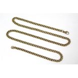 A 9ct. gold curb-link chain, 21” long (27gm).