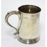 A modern silver christening mug of baluster shape, with scroll handle & on short round foot; 4”