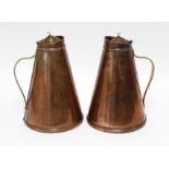 A pair of W. A. S. Benson Arts & Crafts copper “Jacketed Jugs” of tapered cylindrical form, with
