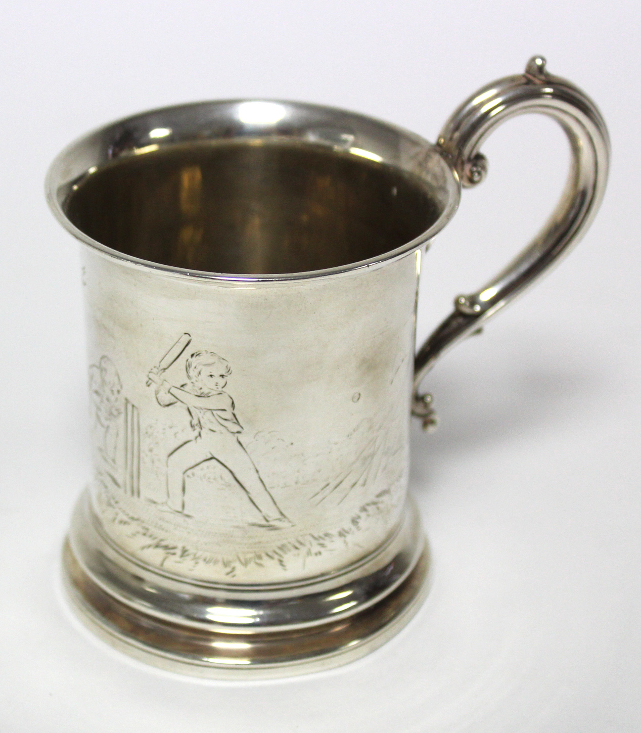 A Victorian christening mug of cylindrical form, with scroll handle & engraved figure scene of two