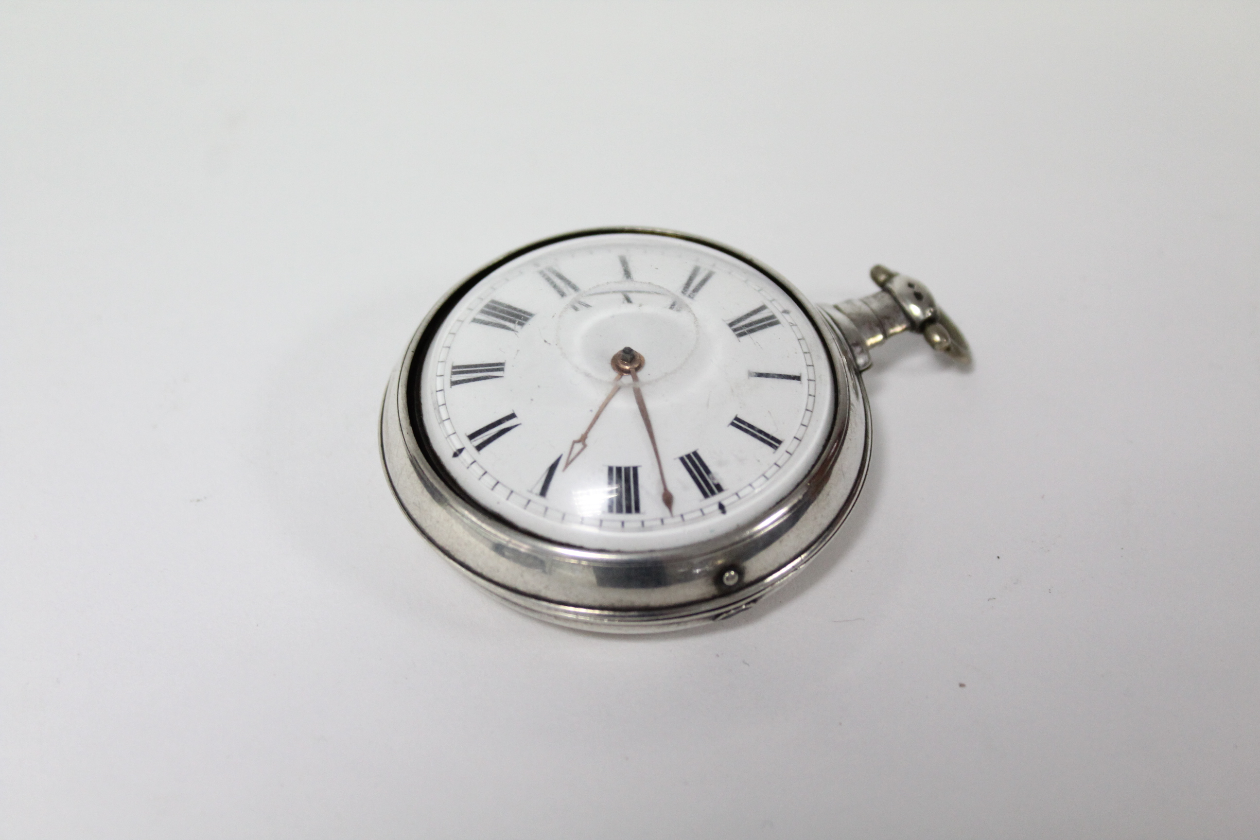 A George III silver pair-cased pocket watch with black roman numerals to the white enamel convex - Image 2 of 11