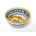 An Italian polychrome faience pilgrim’s bowl, decorated with the Virgin Mary & Child, inscribed: “