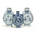 A pair of 19th century Chinese blue & white porcelain moon flasks with Kui dragons to the short