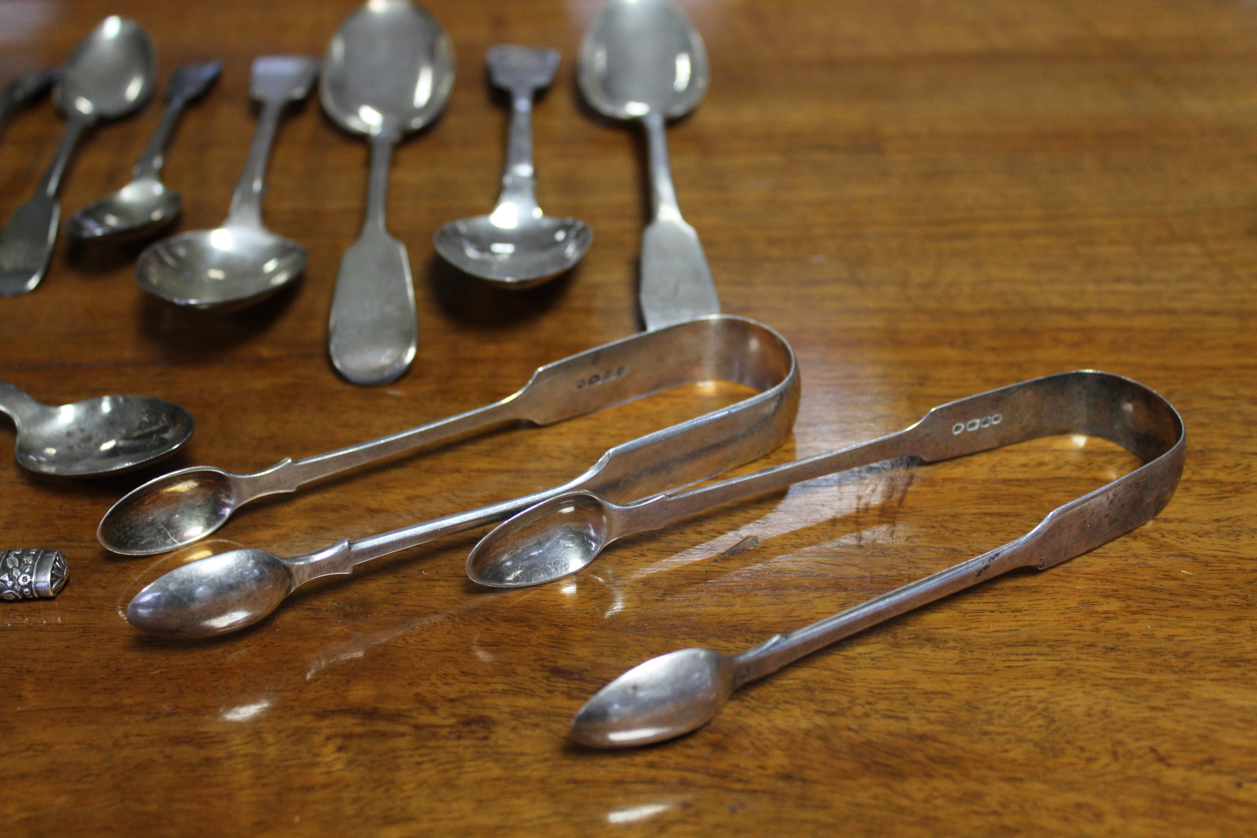 Two pairs of Victorian silver Fiddle pattern sugar tongs; four Georgian & Victorian Fiddle pattern - Image 4 of 6