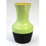 A Clarice Cliff “Milano” pattern vase of lime green ground with black ground ribbed lower part