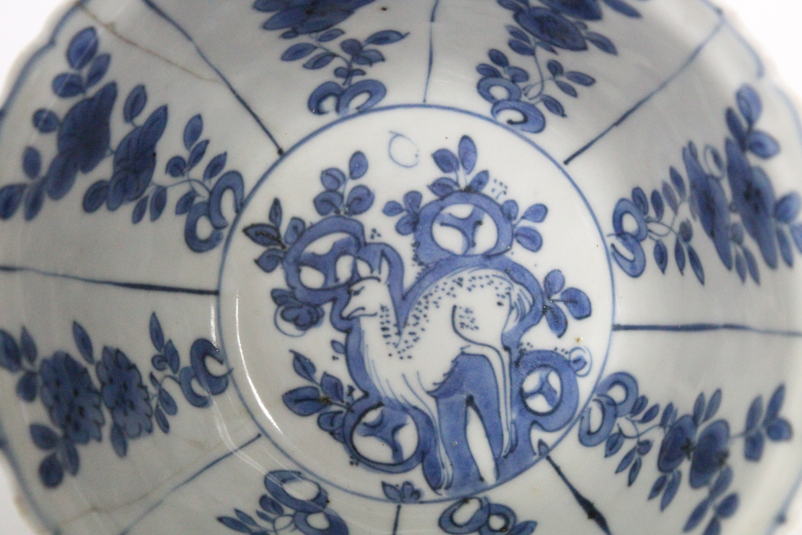 A Chinese blue & white porcelain deep bowl with lotus rim, painted with panels of deer amongst - Image 5 of 24