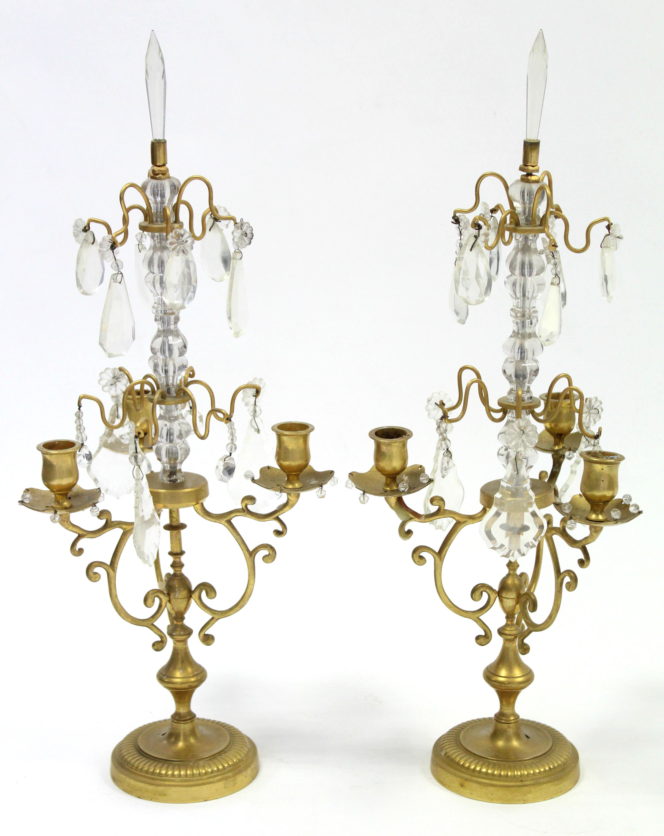 A pair of 19th century gilt-brass three-branch candle lustres, with scroll arms, & hung with cut-