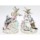 A pair of Samson porcelain romantic male & female figure groups, each dressed in colourful 18th