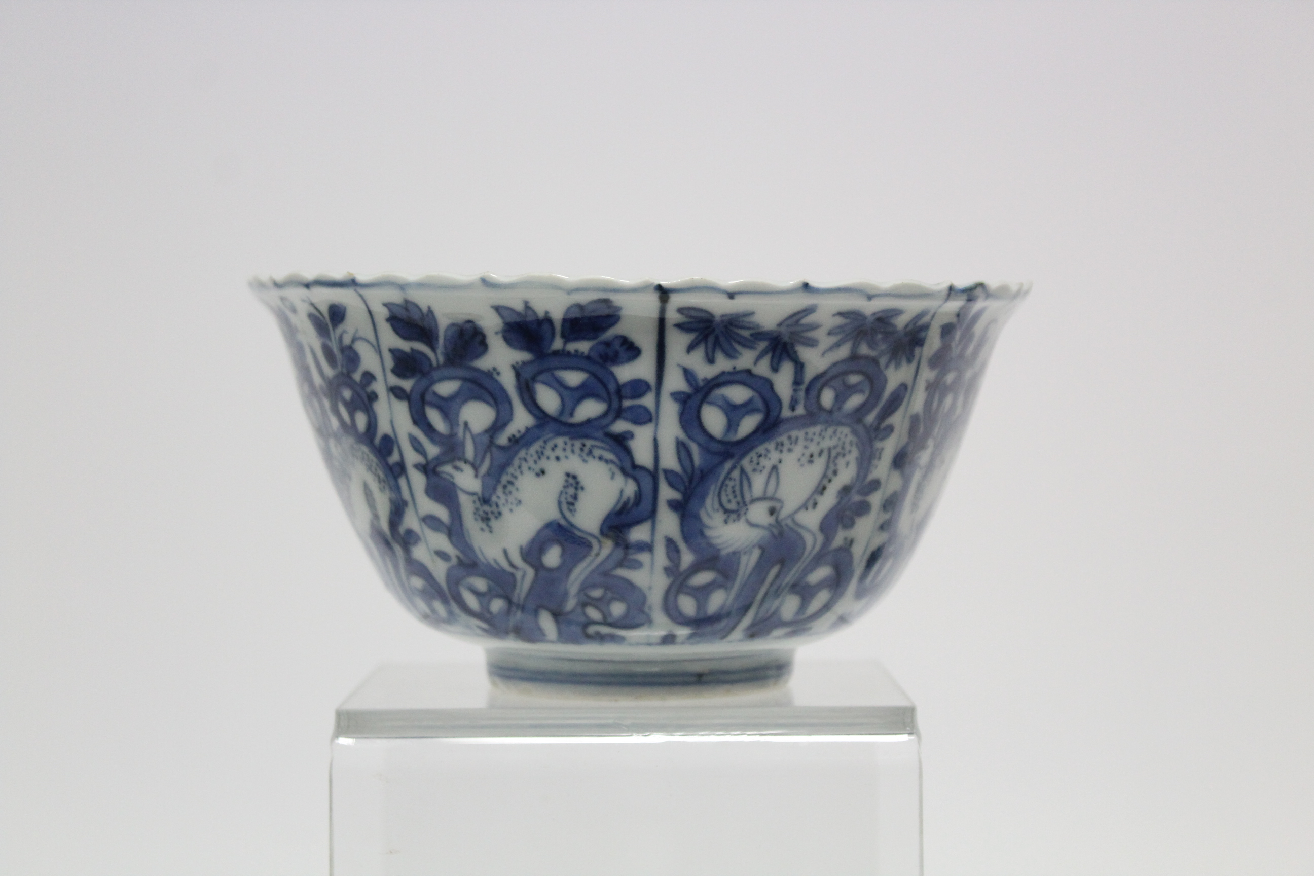 A Chinese blue & white porcelain deep bowl with lotus rim, painted with panels of deer amongst - Image 10 of 24