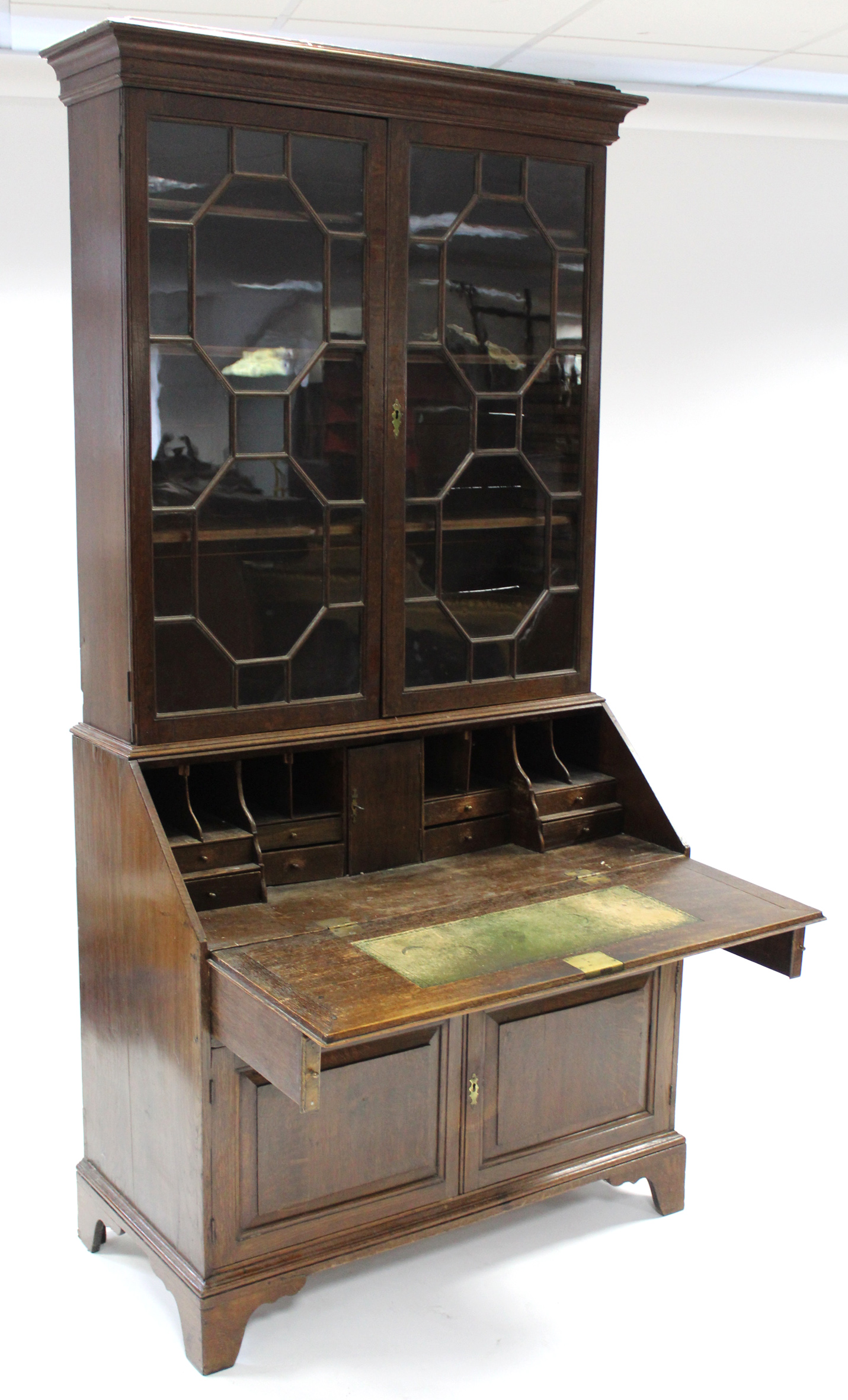 An 18th century oak bureau-bookcase, the upper part fitted three adjustable shelves enclosed by pair - Image 2 of 6