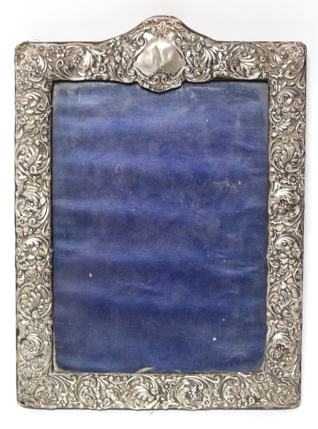 A late Victorian rectangular photograph frame with all-over embossed floral decoration, Sheffield