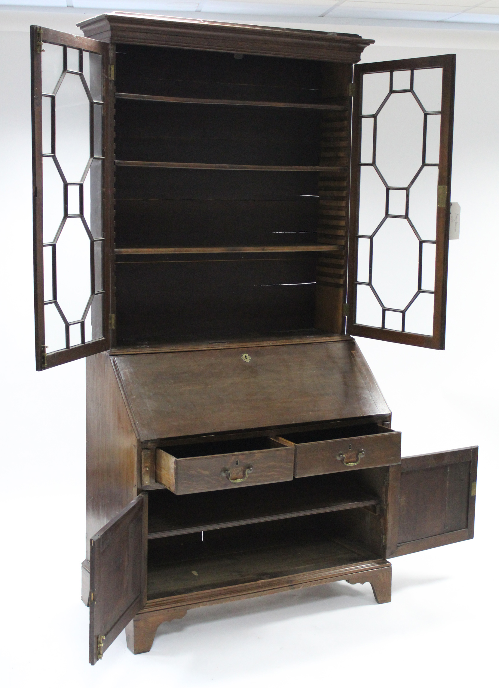 An 18th century oak bureau-bookcase, the upper part fitted three adjustable shelves enclosed by pair - Image 5 of 6