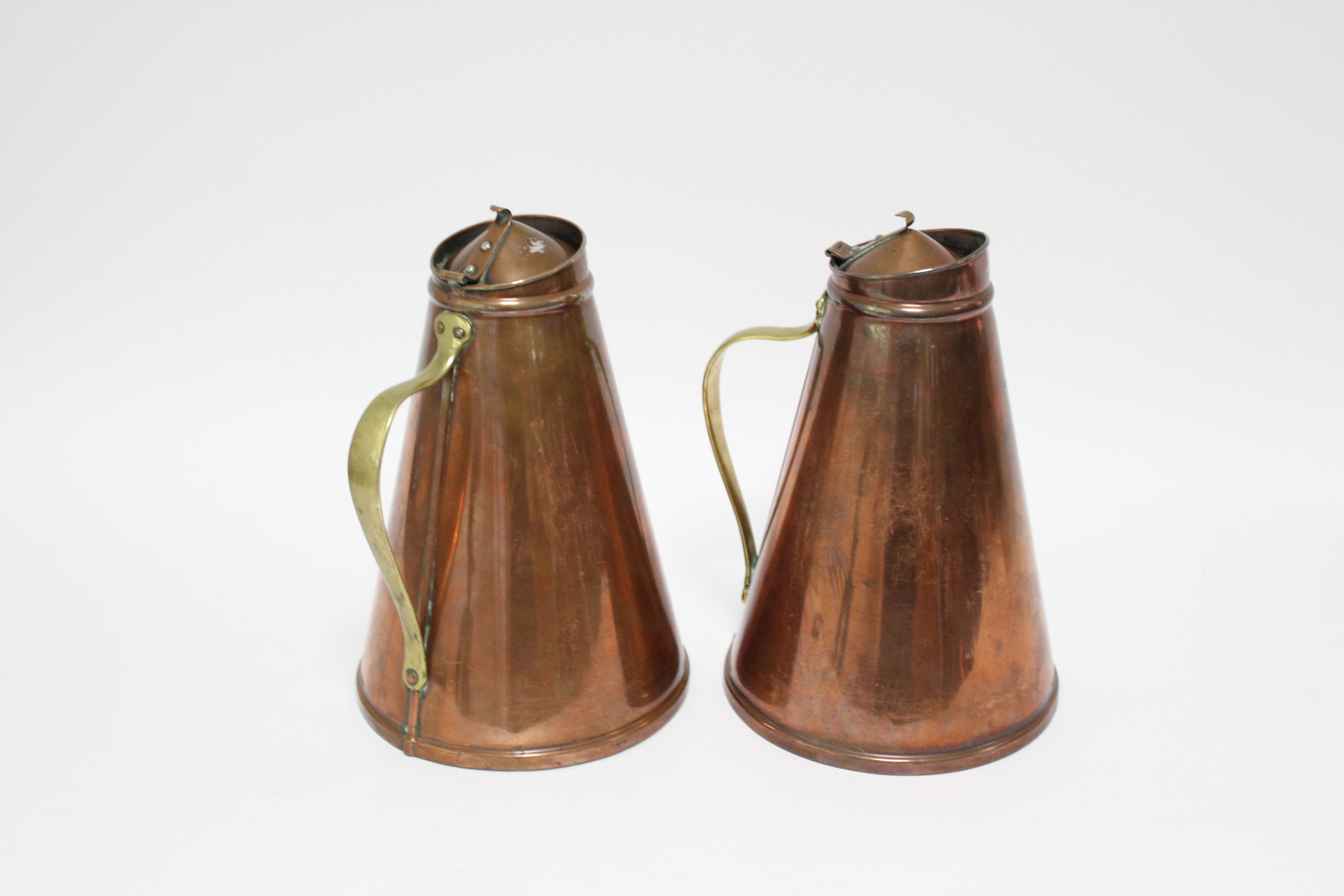 A pair of W. A. S. Benson Arts & Crafts copper “Jacketed Jugs” of tapered cylindrical form, with - Image 5 of 8