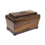 A regency Goncalo Alves tea caddy of rectangular tapered form with egg-&-dart decoration & fitted