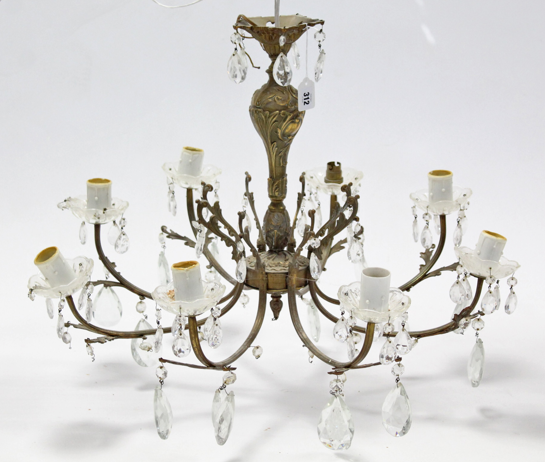 A gilt-metal eight branch chandelier with scroll arms & hung with prism drops, 26” wide x 18” high.