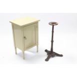 A cream painted mahogany bedside cabinet enclosed by panel door, & on short turned legs, 18” wide, &