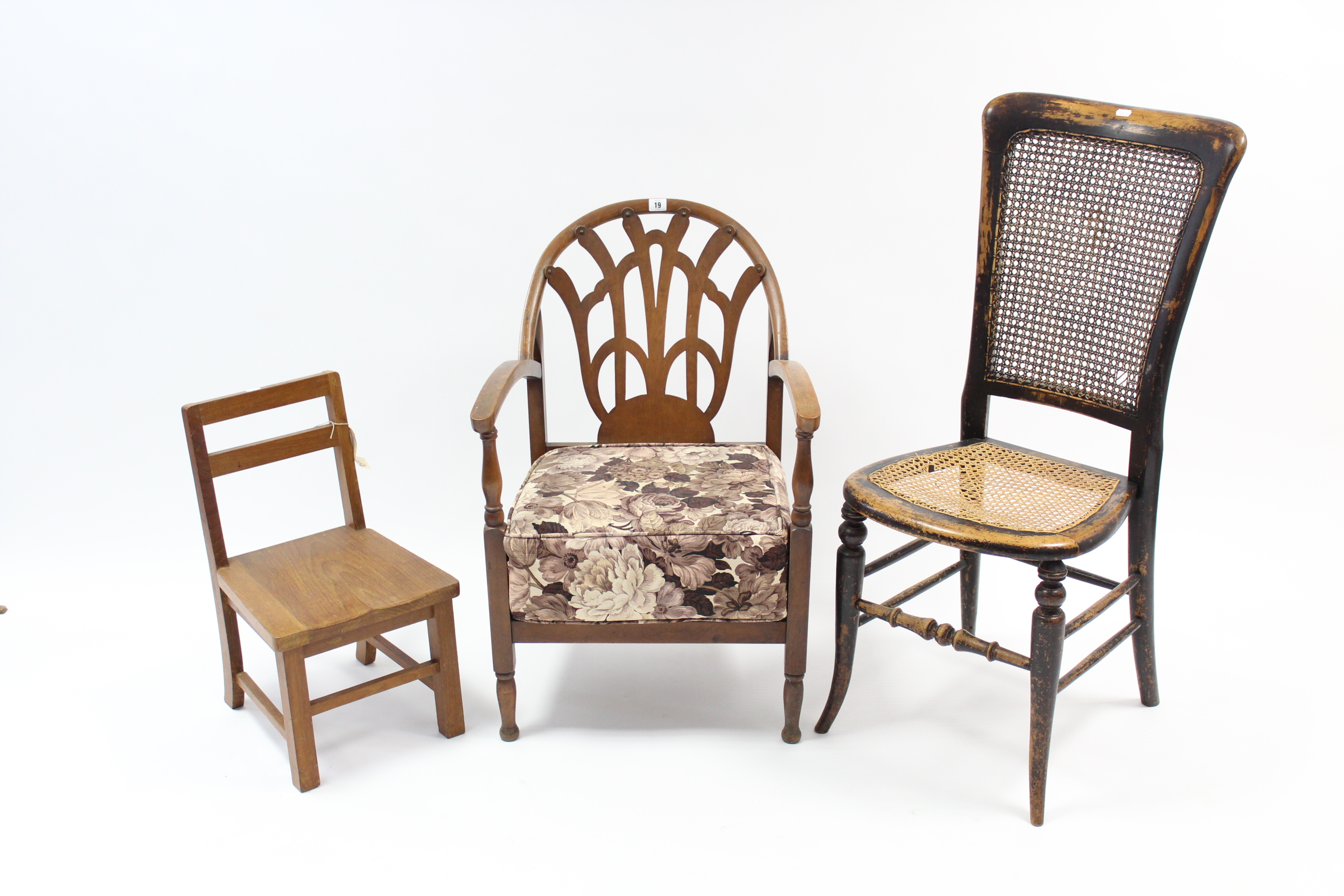 A 1930’s beech low elbow chair; a cane-seat bedroom chair; & a child’s hard seat chair; three