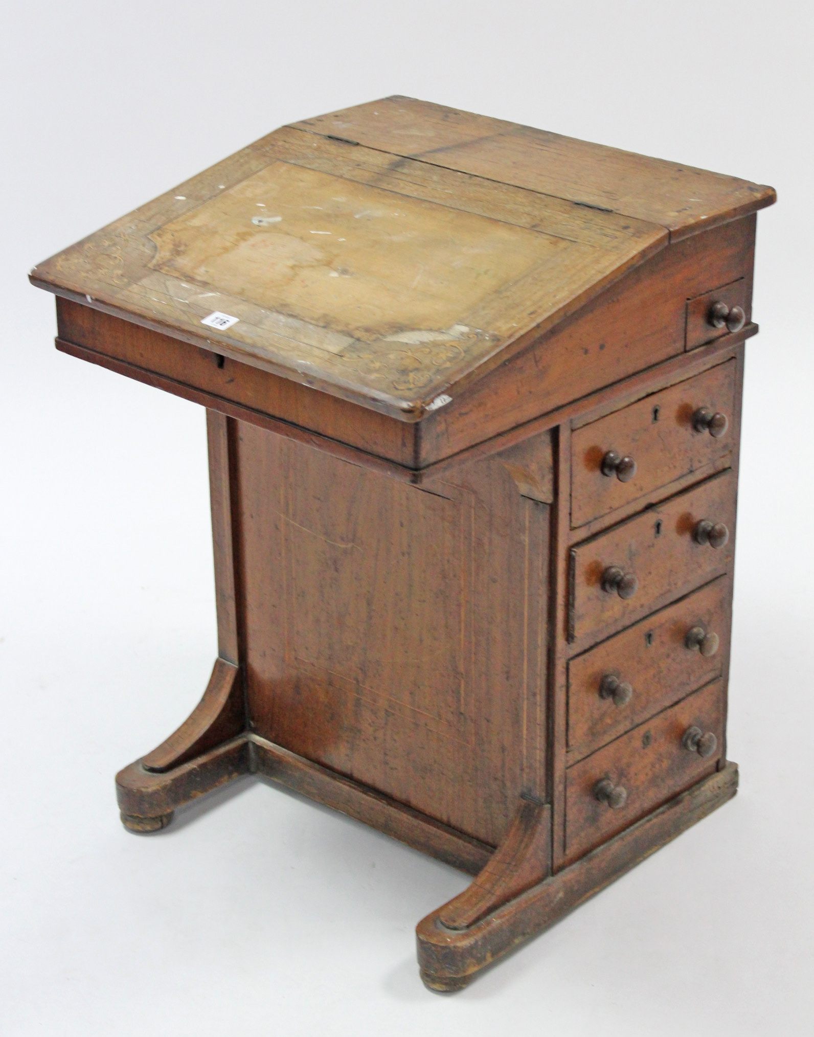 A 19th century inlaid-walnut davenport (lacking leather cloth), enclosed by fall-front, & fitted