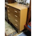 A mahogany-finish small chest fitted four long graduated drawers, & on short square tapered legs,