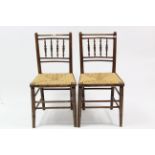 A pair of late Victorian ash spindle-back occasional chairs with woven rush seats, & on round