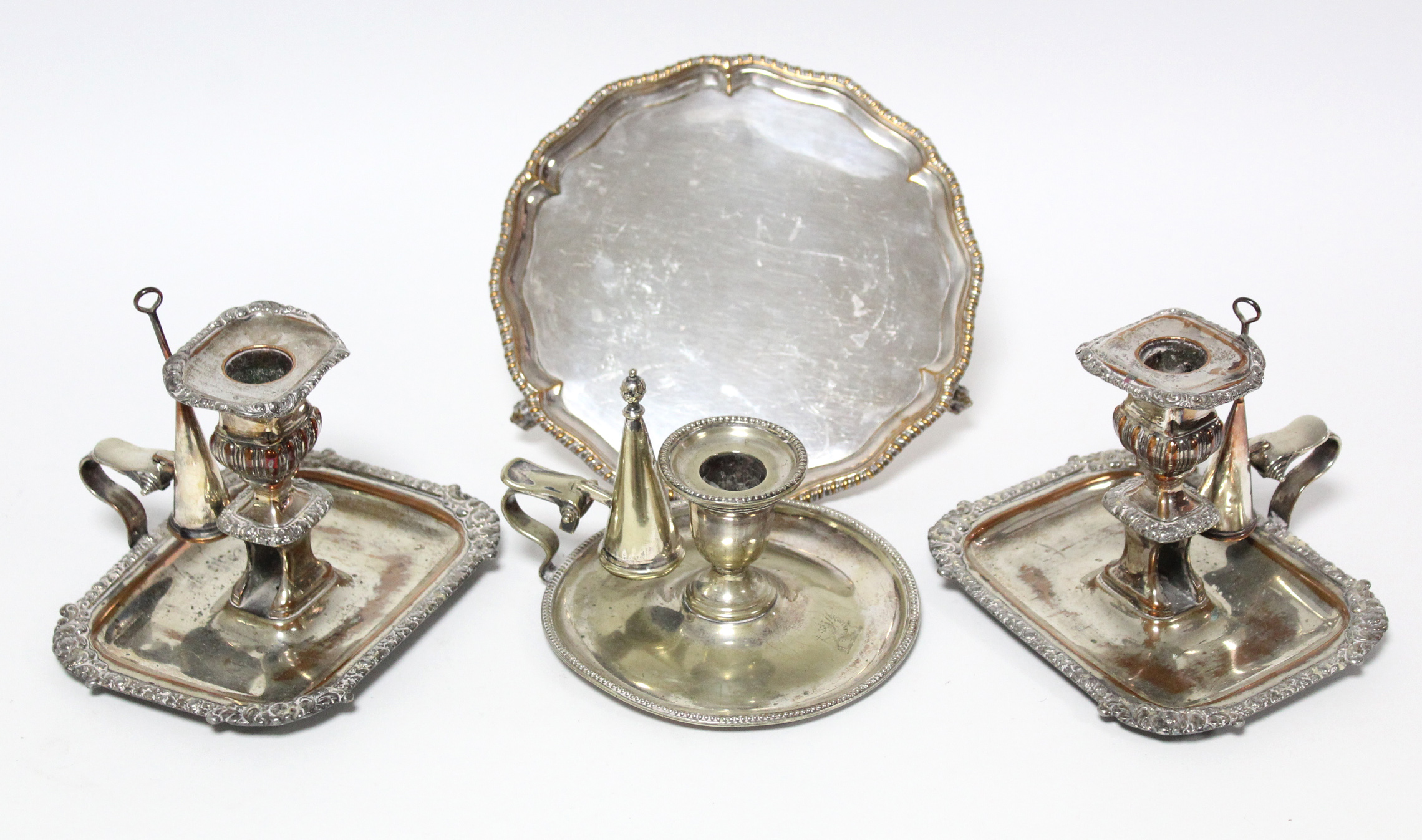 A pair of early 19th century chamber candlesticks, both with snuffers, on rectangular base, (w.a.