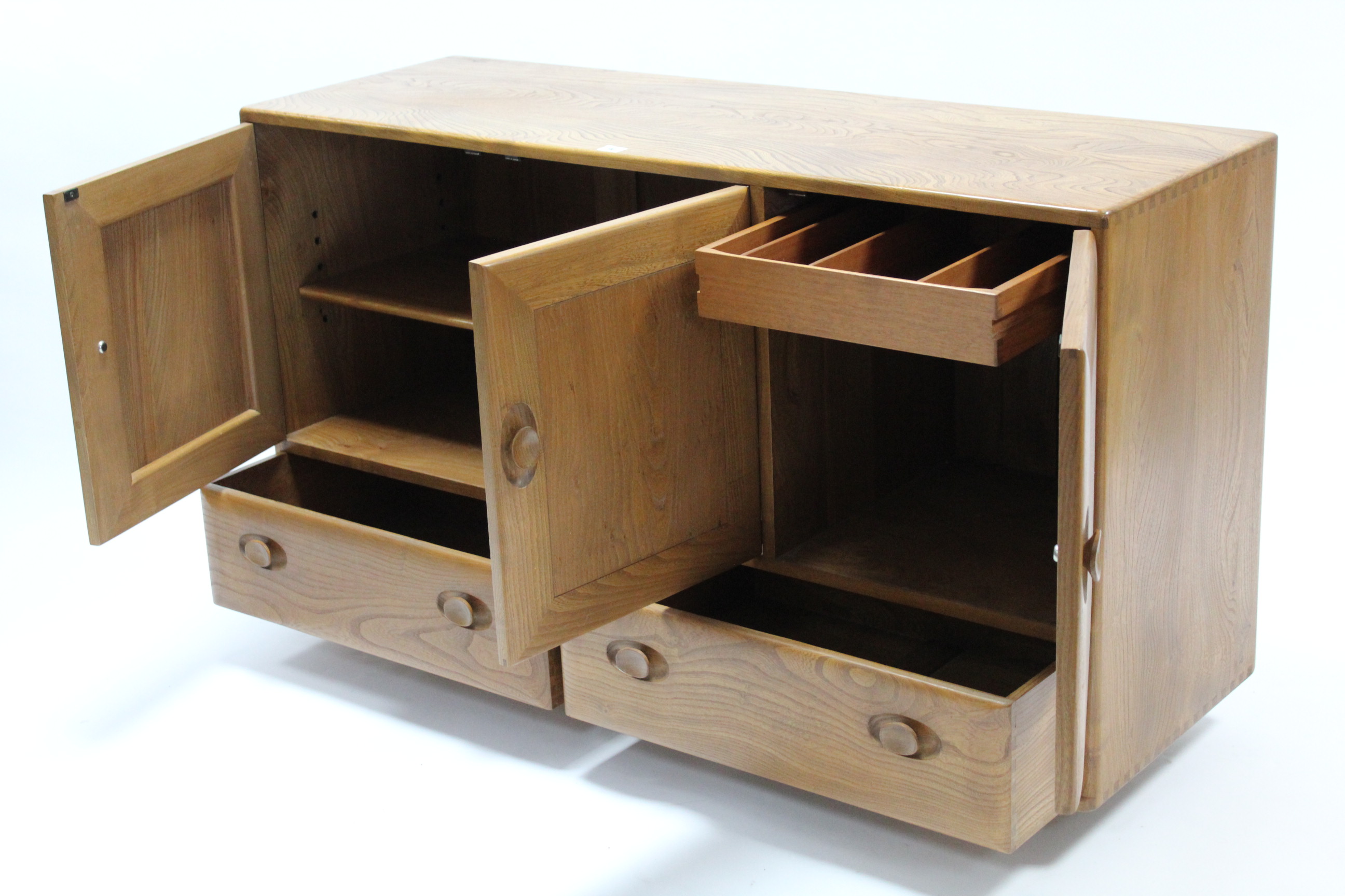 AN ERCOL LIGHT ELM SIDEBOARD enclosed by three panel doors above two short drawers, & on Shepherd’ - Image 2 of 2