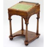 A Victorian style yew wood davenport inset gilt-tooled green leather cloth to the hinged lift-lid, &