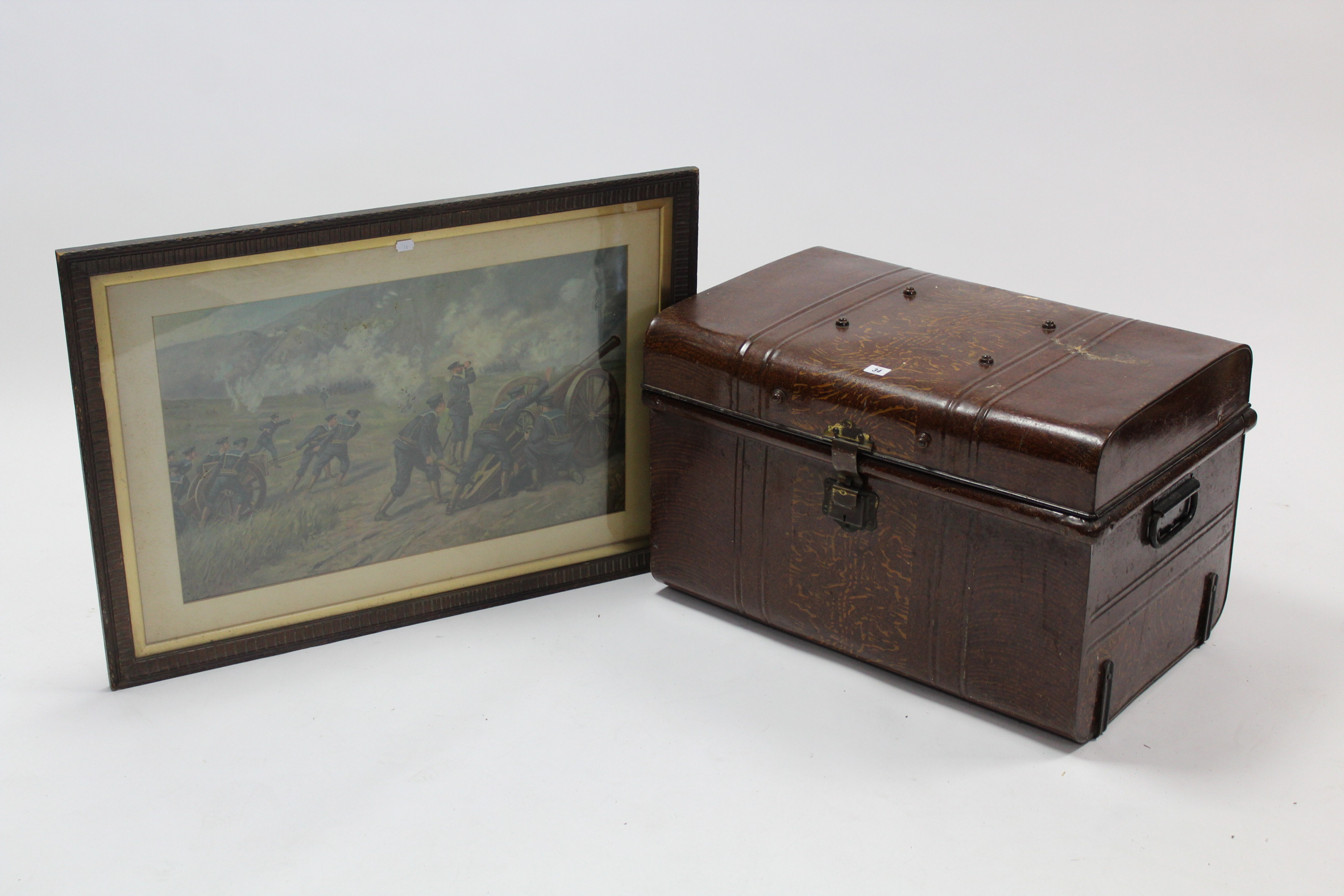 An early 20th century grained tin travelling trunk with hinged lift-lid & with wrought-iron side