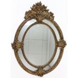 A 19th century-style large gilt-frame oval wall mirror, 54” x 40”.