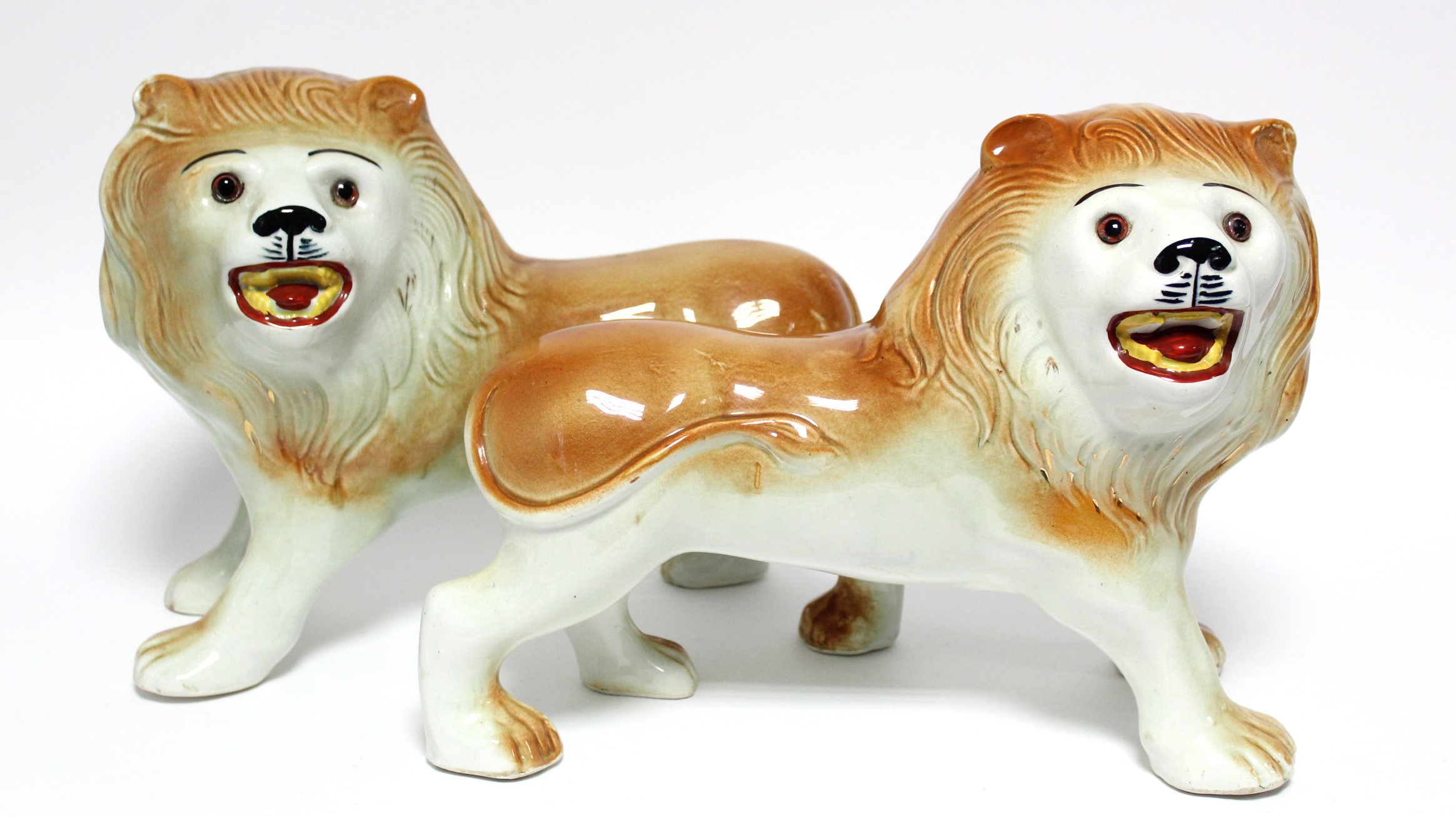 A pair of early 20th century Sadler Pottery large standing models of roaring lions with inset