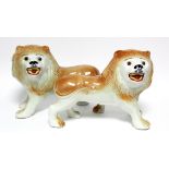 A pair of early 20th century Sadler Pottery large standing models of roaring lions with inset