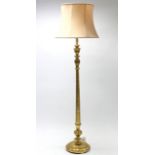A giltwood standard lamp with spiral-twist & turned centre column & on round base with shade.