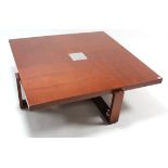A mahogany-finish large square low coffee table inset plated insert to centre & on square supports