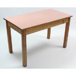 A pine kitchen table with red Formica top, & on four square legs, 48” x 26”.
