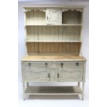 A 1930’s white painted & natural oak dresser, the upper part with small centre cupboard above an