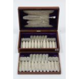 A set of twelve Walker & Hall electro plated fish knifes & forks; & a matching pair of servers, in
