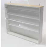 A white finish haberdashery shop’s cabinet fitted with four rollers, 46 ½” wide x 39½” high.