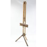 A Daler-Rowney wooden artist’s fold-away easel, 73” high.