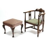 An early 20th century square foot stool, the padded seat upholstered pink velour, & on walnut