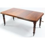 A Victorian mahogany extending dining table with moulded edge & rounded corners to the rectangular