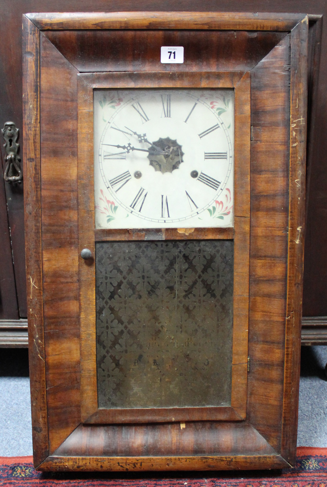 An early 20th century American wall clock by Jerome & Co. of New Hauch Connecticut, with painted