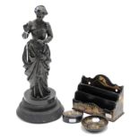 A spelter ornament in the form of a standing female figure reading a book 16¼” high; & three