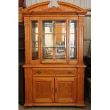 A reproduction walnut-finish tall side cabinet the upper part fitted two plate-glass shelves