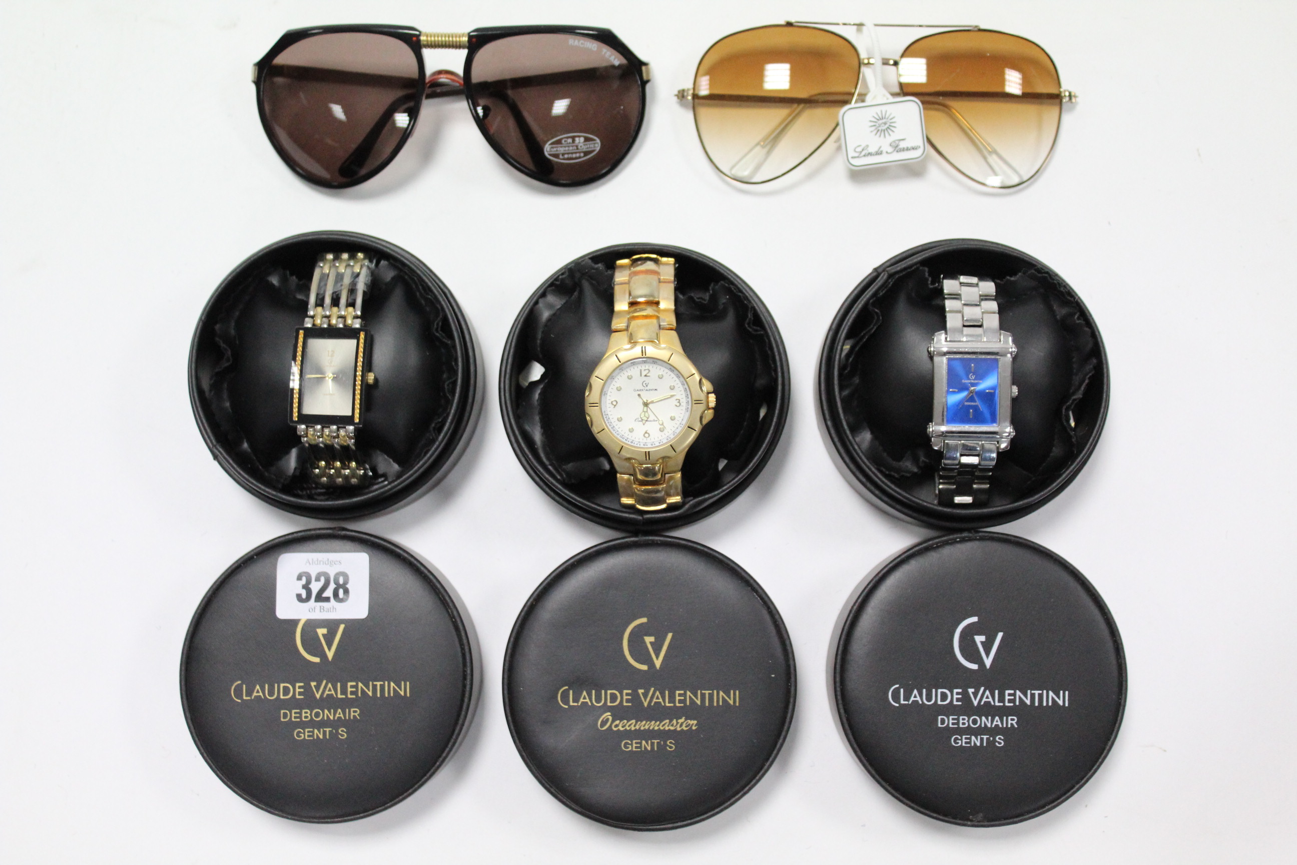 Three Claude Valentini gents wrist watches; & two pairs of sunglasses.