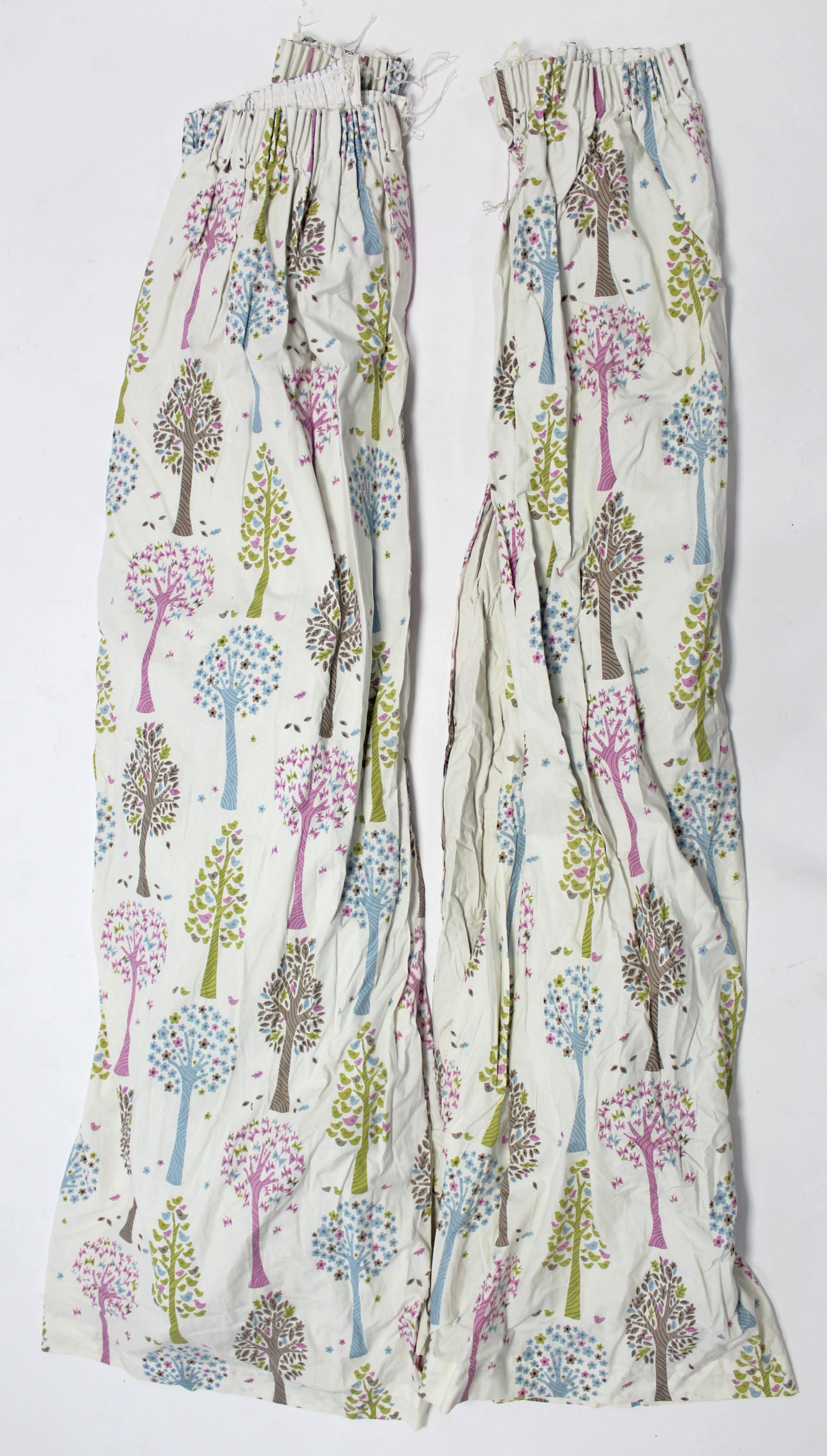 Two pairs of lined curtains of white ground & with repeating multi-coloured tree design 84” drop x