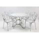 A White painted art-metal patio table with pierced circular top & on three shaped legs, 35” diam.; &