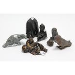 A Chinese bronzed male figure; four Inuit animal figures; & three bird ornaments.
