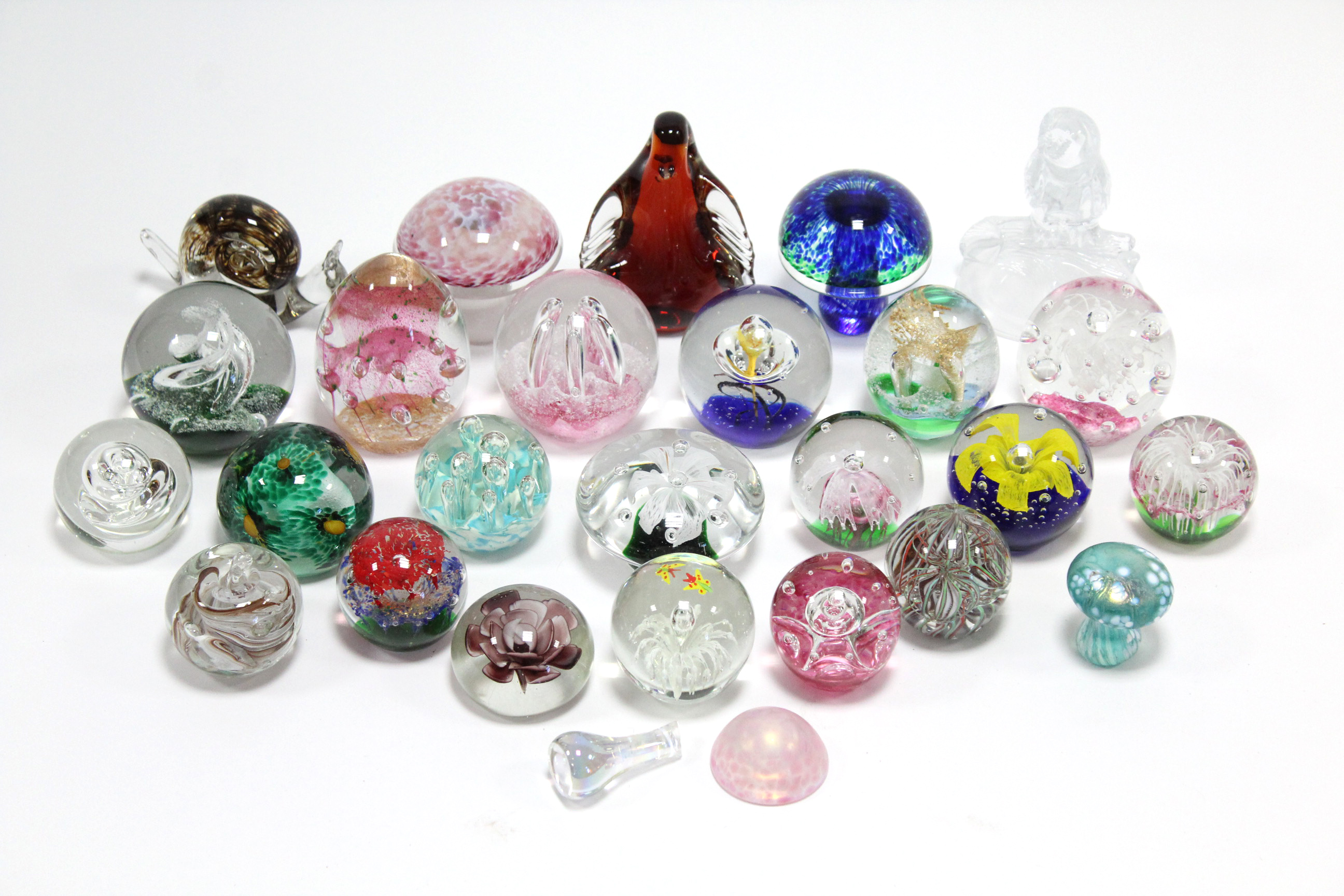 A collection of forty glass paperweights.