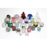 A collection of forty glass paperweights.