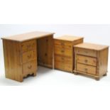 A pine kneehole child’s desk fitted three long drawers to the left-hand side, 38½” wide; & two